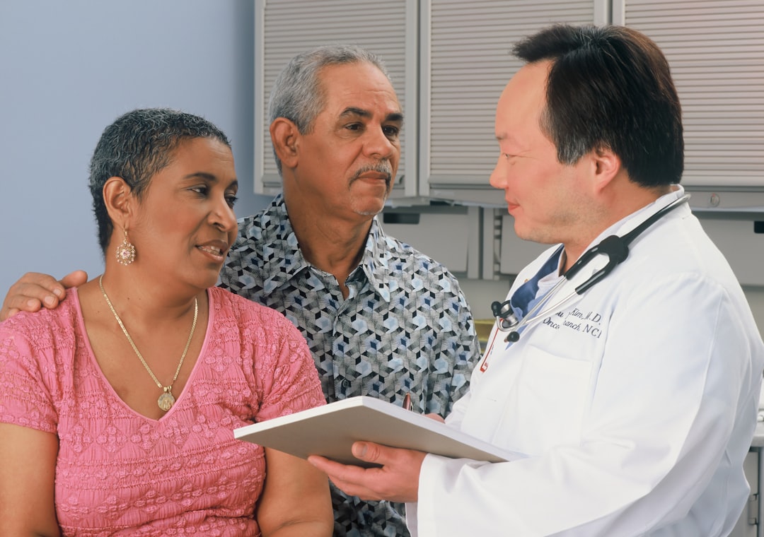 Caregiver and older adult during a medical consultation