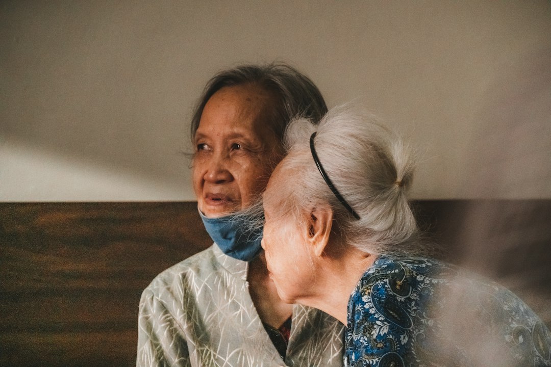 Family caregiver spending time with an older adult at home